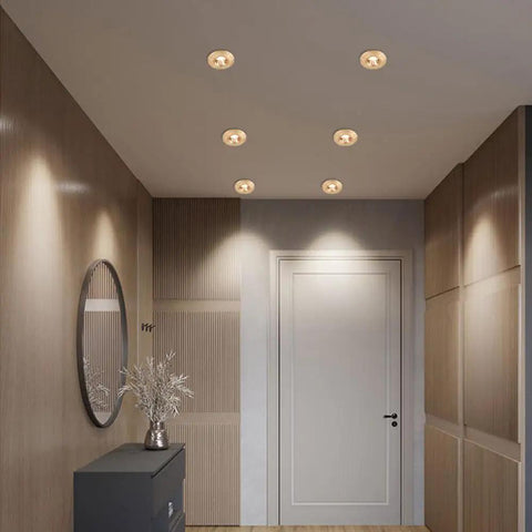 UWYTGF 5 Pack Style Led Recessed Lighting installed in a modern hallway with brass trim and soft lighting.