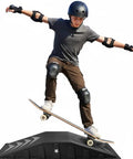 Skateboarder performing a trick on Single-Piece Skateboard Ramp For Beginners, 44 Inches Long, 220 Pounds Capacity, Durable Non-Slip Textured Surface