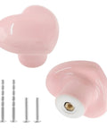 Pink Heart Shaped Ceramic Cabinet Knobs 2 Pack with screws, smooth glazed finish, suitable for kids rooms, girls bedrooms, and kitchens.