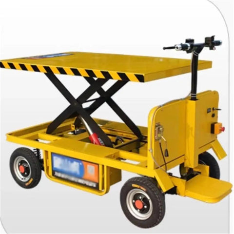 Heavy Duty Hydraulic Lift Table And Four Wheel Manual Push Platform with yellow steel deck for pallet handling and transport on job sites.