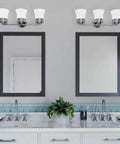 3 Light Coastal Style Bathroom Vanity Light With Dope Etched White Glass Shades Reversible Mounting Antique Bronze Finish in a modern bathroom
