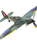 Green and grey RC airplane flying with visible spinning propellers and detailed decals.