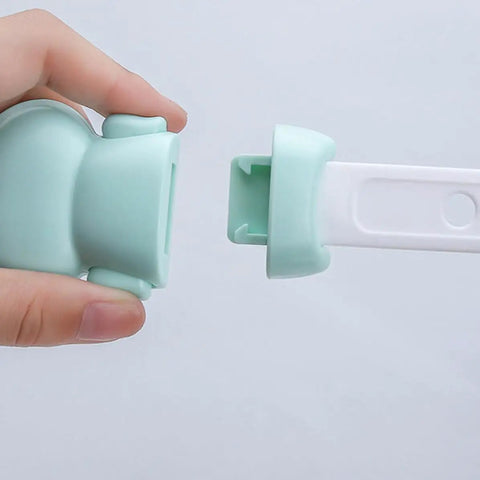 Close-up of 5 Pack Kid Proof Safety Cabinet Locks with 3 Adjustable Modes, showing a cartoon shape design in mint green.