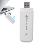 Hella Portable 4G LTE Wireless Router With Solid Battery Life And Zero Lag Signal For Road Trippers Desk Grinds Or Couch Lounging Across Europe With Slick Compact Design And Simple Plug In Setup connected to a laptop.