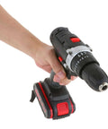 Hand holding Built Tough Cordless Drill And Driver Kit With Battery Charger, featuring ergonomic design and robust drill head.
