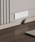 Italy power outlets on wall above large modern office desk with two storage drawers and rolling side cabinet solid wood study table