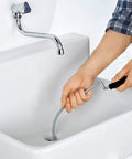 Pro Grade 10 Foot Metal Drain Cleaner and Clog Remover With Flexible Drain Snake being used in a sink