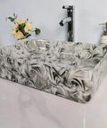 USZWBY Vessel Sinks Bathroom Vessel Sink Hotel Art Wash Basin Marble Pattern Ceramic Bathroom Bowl Sink on a counter with faucet.