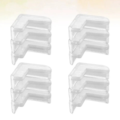 Four stacks of transparent PVC corner guards for tables and cabinets, showing the design of 30 Pcs Table Corner Protectors With Heavy Duty Adhesive Tape Soft PVC Safety Corner Guards For Anti Collision And Impact Absorption On Tables And Cabinets Easy Install No Tools Needed Keeps Kids And Pets Safe.