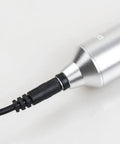 Close-up of Universal DC Power Cord for Tattoo Machines with Pen Rotary Systems connected to a device, durable connector.
