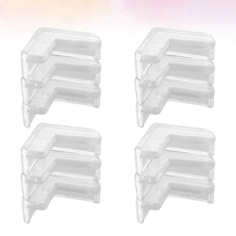 30 Pcs Table Corner Protectors With Heavy Duty Adhesive Tape Soft PVC Safety Corner Guards neatly stacked in four piles