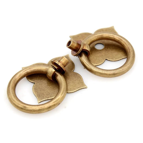 Set Of 4 Vintage Antique Bronze Ring Pulls In Pure Solid Brass Four Leaf Clover Base Retro Cabinet Hardware shown in close-up view.