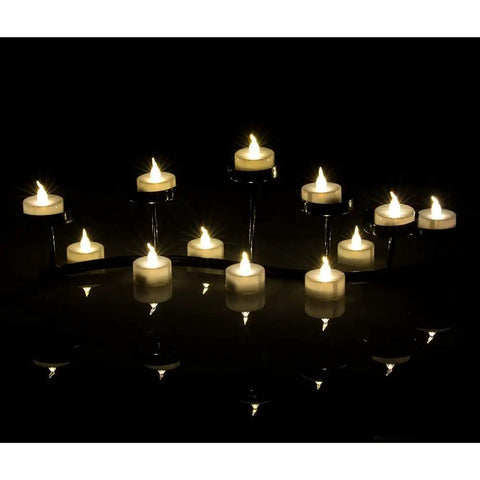 24 Pack Flickering LED Tea Lights With Timer 6 Hour Auto On Off Battery Operated Flameless Tealights glowing on holders