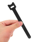 150 Piece Cat Head Cable Management Straps Heavy Duty Nylon Wire Ties in hand, showcasing smooth design for organizing cords.