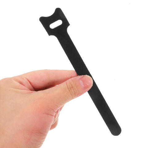 150 Piece Cat Head Cable Management Straps Heavy Duty Nylon Wire Ties in hand, showcasing smooth design for organizing cords.