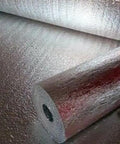 Double Sided Reflective Foam Insulation Roll That Blows Away Utility Bills Blocks Radiant Heat Quick Peel Hang For Attics Walls And Crawlspaces R8 Rated Ultra Thick Five Millimeter Core Seventy Two By Two Hundred Feet Made In Usa with shiny surface and visible roll.