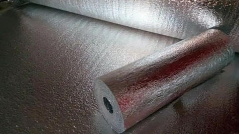 Double Sided Reflective Foam Insulation Roll That Blows Away Utility Bills Blocks Radiant Heat Quick Peel Hang For Attics Walls And Crawlspaces R8 Rated Ultra Thick Five Millimeter Core Seventy Two By Two Hundred Feet Made In Usa with shiny surface and visible roll.