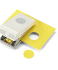 1.25 Inch Circle Punch with Safety Lock for card making, scrapbooking, gift tags, shown cutting a yellow cardstock circle