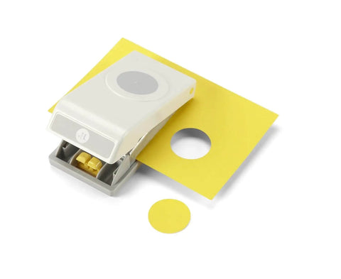 1.25 Inch Circle Punch with Safety Lock for card making, scrapbooking, gift tags, shown cutting a yellow cardstock circle