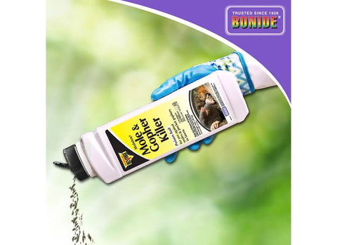 Gloved hand pouring Mole And Gopher Killer Poison Bait Granules One Pound Ready To Use Lawn Pest Control For Pocket Gophers And Moles