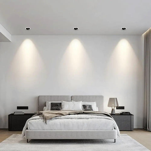 LED Recessed COB Spotlight illuminating a modern bedroom with a sleek gray bed and soft white walls.