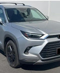 Badass Solid Heavy Duty Roof Rack Crossbar Fits Toyota Grand Highlander 2023 2024 2025 2026 Specific Fitment For Factory Rails Holds 150 Lbs Load Boosts Storage And Style Installing Quick Performs Like Magic For Outdoor Adventures Anytime. Silver Toyota Grand Highlander with factory roof rails and black roof rack crossbars