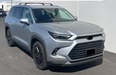 Badass Solid Heavy Duty Roof Rack Crossbar Fits Toyota Grand Highlander 2023 2024 2025 2026 Specific Fitment For Factory Rails Holds 150 Lbs Load Boosts Storage And Style Installing Quick Performs Like Magic For Outdoor Adventures Anytime. Silver Toyota Grand Highlander with factory roof rails and black roof rack crossbars