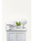 Traditional Classic Leather Texture Vinyl Wallpaper Durable Type Two Commercial Wallcovering in light beige with white towels.