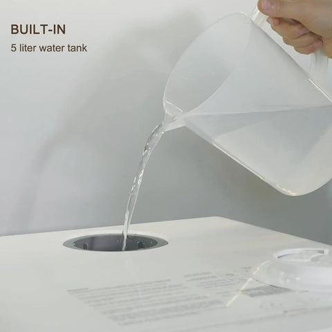 Portable Countertop Dishwasher With Built In Water Tank pouring water into built-in 5 liter tank, showcasing easy refilling.