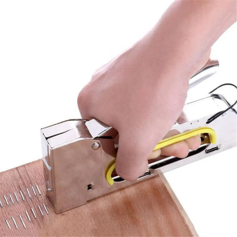 Heavy Duty Industrial Loading Machine Stapler With Adjustable Lever And Push Button Slot For Office Papers Magazines Nails And Hardware Fasteners in use on wood surface.
