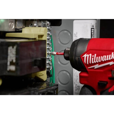 Milwaukee cordless impact driver side view driving a bit into an electrical panel terminal block