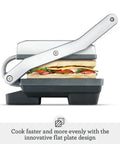 Brushed Stainless Steel Panini Maker With Dual Independent Heating Zones For Even Grilling And Toasting side view with sandwiches inside.