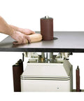 Powerful One Horsepower Oscillating Spindle Sander featuring rock solid cast iron table, hands placing wood on sander.