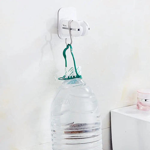 Wall-mounted adjustable shower head holder securing a large water bottle, demonstrating the adhesive strength and versatility.