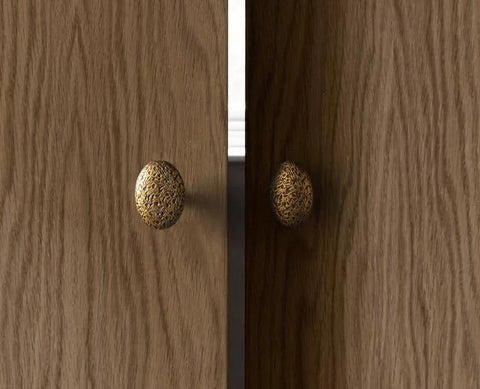 Six Pack Zinc Alloy Drawer Knobs In Big Oval Antique Brass Finish installed on wooden cabinet doors