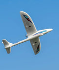 Prodigy 1400mm Wingspan RC Plane With Vector Flight Stabilization System 4 Channel Remote Control Airplane soaring in the sky.