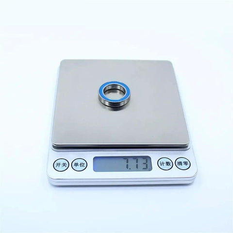 6803RS Deep Groove Ball Bearing Set 17x26x5 Mm on scale showing weight for Hobby Electric RC Cars and Trucks