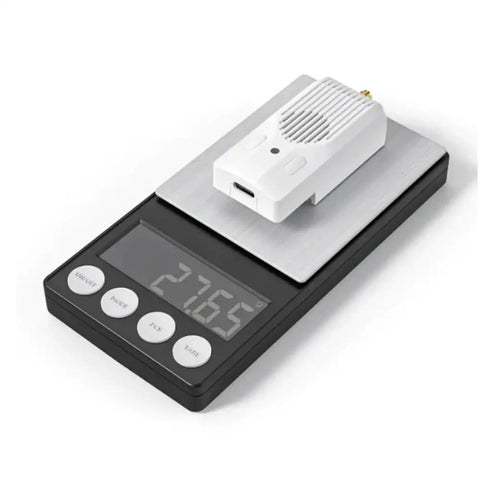 ExpressLRS Nano RC TX V2 Module With 2.4GHz 915MHz 1000mW on digital scale showing weight