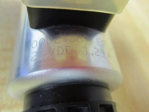 Close-up of 4WE 6 D62/OFEG24N9K4/ZV Directional Solenoid Spool Valve R901068630, showing engraving and 24 VDC 1.25A rating on metal surface.