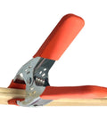 Heavy Duty Metal Spring Clamps With Ergonomic Handles Built Tough For Woodworking Carpentry And Model Making Red Coated Shop Essentials Straight Up Dependable Workhorse securing wood with comfort grip.