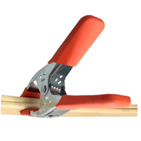 Heavy Duty Metal Spring Clamps With Ergonomic Handles Built Tough For Woodworking Carpentry And Model Making Red Coated Shop Essentials Straight Up Dependable Workhorse securing wood with comfort grip.