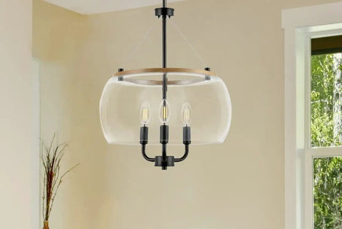 Orono 3 Light On Trend Modern Farmhouse Black Pendant Ceiling Light With Wood Accent And Clear Glass Shades in room setting