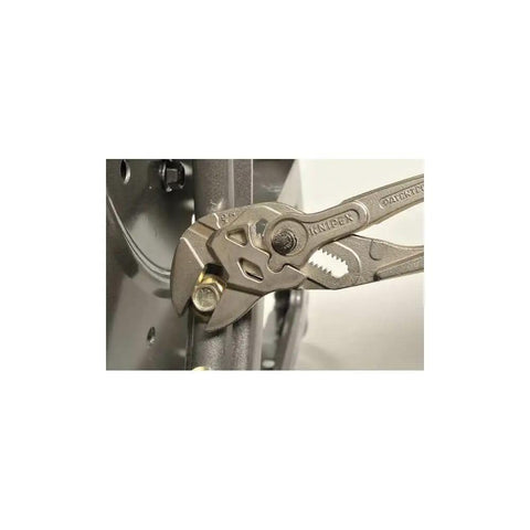 Do It All Pliers Wrench Chrome Finish With Smooth Jaws Replaces Metric And Imperial Spanners gripping a bolt on metal surface