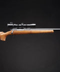 Beast Mode Bolt Action Airsoft Sniper Rifle with adjustable magnified aluminum scope, wood stock, and metal rail, side view
