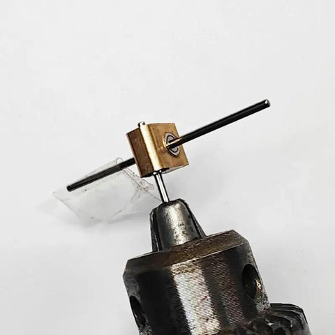 Hella Reliable Micro Worm Gearbox With One Damn Fine 12 To 1 Reduction Ratio seen from above, showcasing metal housing and output shaft.