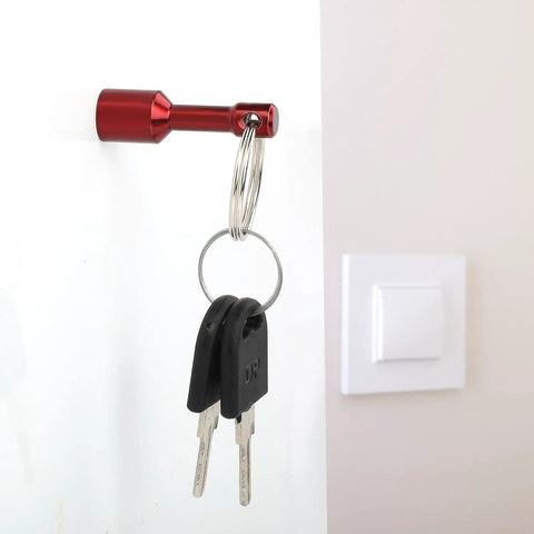 10 Pack Keychain Magnets for Gold and Jewelry Testing with red key holder on white wall