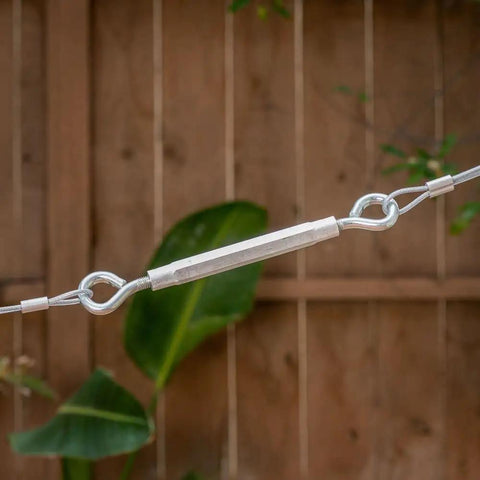 High Grade Eye To Eye Turnbuckle Half By Seventeen Inch Aluminum Zinc Coated Hex Grip Cable Tensioner No Sweat Adjustment Tool shown inline with cable.