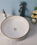 USZWBY Vessel Sinks Simple Hotel Bathroom Ceramic Sink Home Round Above Table Basin with gold rim and sleek faucet.