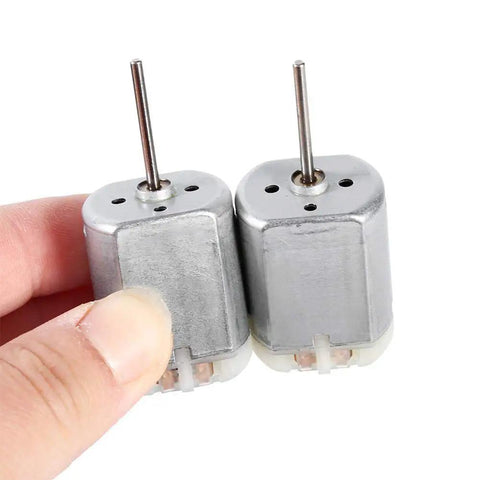 Two 22mm D-Shaft Door Lock Actuator Motor, 12V DC Flat Shaft Replacement for Car Doors in hand, high RPM, smooth operation.