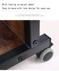 Close-up of locking wheel on Height Adjustable Overbed Table With Smooth Rolling Wheels And Built In Storage Trays For Sofa Bedside Use Solid Brown Laptop Stand.